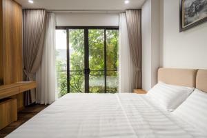Postel nebo postele na pokoji v ubytování Studio-Vincent Apartment HaNoi