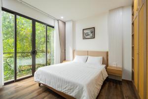 Postel nebo postele na pokoji v ubytování Studio-Vincent Apartment HaNoi + 37 fotografií