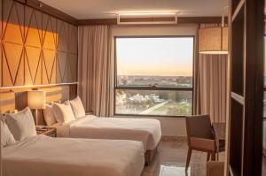 Cama ou camas em um quarto em DoubleTree by Hilton - Resort - Foz do Iguaçu