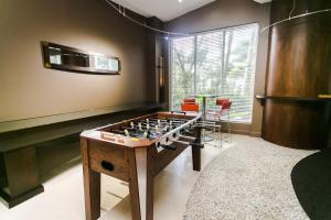 a large game room with a foosball table at Sian Oceanfront Condos in Hollywood
