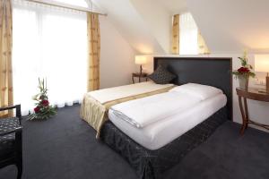 Katil atau katil-katil dalam bilik di Hotel Ochsen Stuttgart