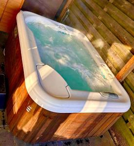 a cell phone sitting on top of a wooden table at Tiny house with sauna & jacuzzi near Amsterdam in Vijfhuizen