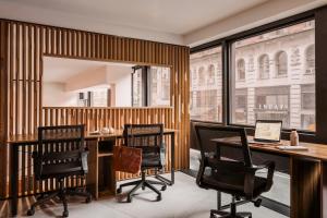 an office with two chairs and a desk with a laptop at Sonder Flatiron in New York