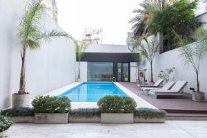 The swimming pool at or close to Olmo Deluxe Loft Apartment