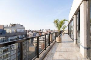 A balcony or terrace at Olmo Deluxe Loft Apartment