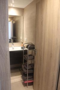 a bathroom with a sink and a towel rack at La Cala de Mijas Apartment in Málaga