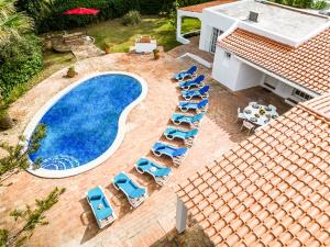 an overhead view of a swimming pool with lounge chairs at Villa AlGharif by Algarve Vacation in Albufeira