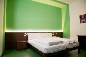 Ένα ή περισσότερα κρεβάτια σε δωμάτιο στο Hotel Villa Flora