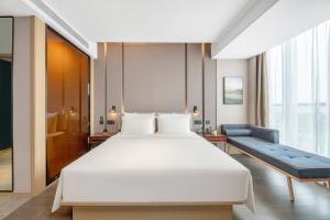 Ένα ή περισσότερα κρεβάτια σε δωμάτιο στο Atour Hotel Xi'an Chanba Exhibition Center Expo Park +16 φωτογραφίες
