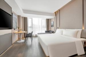 Μια τηλεόραση ή/και κέντρο ψυχαγωγίας στο Atour Hotel Xi'an Chanba Exhibition Center Expo Park
