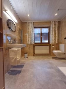 a large bathroom with a sink and a toilet at Apartment Dietrich Sylvia in Mellau