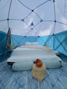 a bedroom with a bed in a tent at Off The Grid Glamps in Khopoli