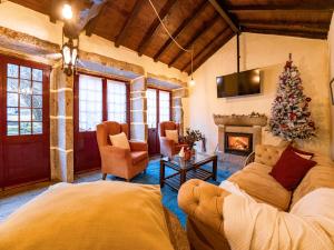 a living room with a christmas tree and a couch at Cantinho d'Azenha in Ponte de Lima