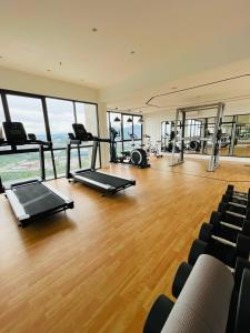 a gym with treadmills and exercise equipment in a building at Nilai Youth City Residence in Nilai