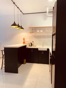 a kitchen with a counter and a sink in it at Nilai Youth City Residence in Nilai