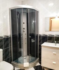 a shower in a bathroom with a toilet and a sink at Solar do Cávado in Vieira do Minho