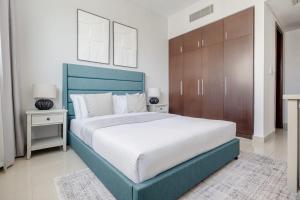 Postel nebo postele na pokoji v ubytování Frank Porter - Marina Blue - Marina Square, Abu Dhabi