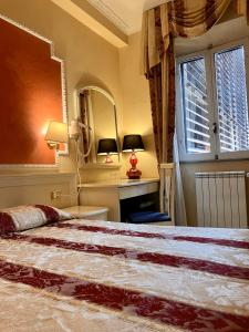 Postel nebo postele na pokoji v ubytování Hotel Erdarelli
