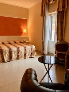 Postel nebo postele na pokoji v ubytování Hotel Erdarelli
