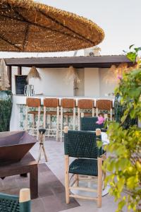 a patio with chairs and a table and a building at Riad N'S in Marrakesh