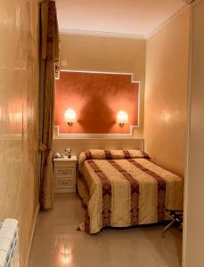 Postel nebo postele na pokoji v ubytování Hotel Erdarelli