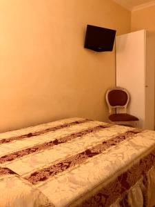 Postel nebo postele na pokoji v ubytování Hotel Erdarelli