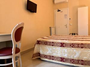 Postel nebo postele na pokoji v ubytování Hotel Erdarelli