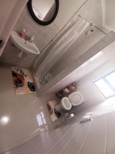 an overhead view of a bathroom with two toilets and a sink at TALITHA'S SELF-CATERING ACCOMONDATION in Walvis Bay