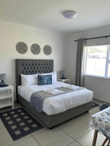Ένα ή περισσότερα κρεβάτια σε δωμάτιο στο Pokey Starfish Holiday Home