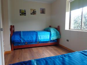 Un pat sau paturi într-o cameră la Cabanas Piedras Preciosas
