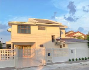 a house with a fence in front of it at heaven in Ban Bang Phai