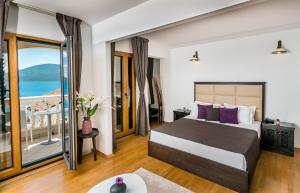 Postel nebo postele na pokoji v ubytování Boutique Hotel Kredo