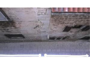 a view of a brick wall in a building at San Eleuterio Guesthouse in Poreč