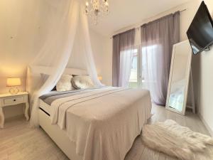 Posteľ alebo postele v izbe v ubytovaní Elite Residence Flos