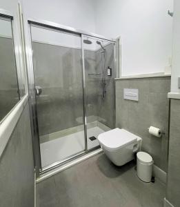 a bathroom with a shower and a toilet at IVY HOUSE in Seville