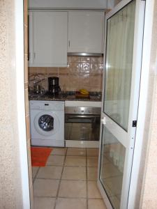 Virtuvė arba virtuvėlė apgyvendinimo įstaigoje Apartamento Aracelli