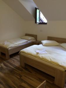 Postel nebo postele na pokoji v ubytování Čuček Guesthouse