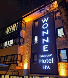 a hotel sign on the side of a building at Wonne Boutique Hotel Spa in Ankara