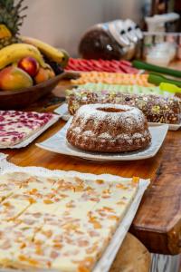 a table topped with lots of different types of food at Hotel Cumbres del Sur in Puc&oacute;n