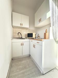 Kuchyňa alebo kuchynka v ubytovaní Elite Residence Flos