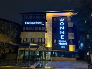 a hotel with a sign on the front of it at Wonne Boutique Hotel Spa in Ankara