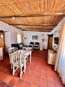 a living room with a table and chairs at Baywatch Paternoster - The Cottage in Paternoster