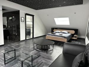 a bedroom with a bed and a coffee table at T4 TRES HAUT STANDING 130 mètres carré in Frontenex-Villard-Rosset +43 photos