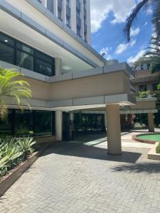 a large building with a walkway in front of it at ArqSuites Berrini WTC SP - Suíte privada dentro do Hotel in São Paulo