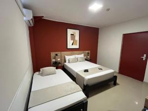 Postel nebo postele na pokoji v ubytování Rua Hoteles Talara