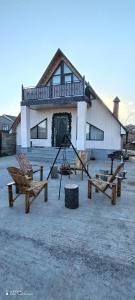 a building with picnic tables in front of it at Qusar-A-frame in Qusar