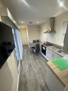 a kitchen with a sink and a counter top at Belraugh Mountain View Hot Tub Lodges in Garvagh