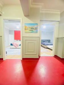a room with a white door and a red floor at TRANSIT in Istanbul