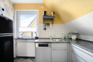 Kuchyň nebo kuchyňský kout v ubytování Ferienwohnung Nordmeer