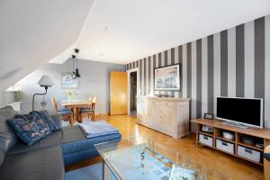 TV a/nebo společenská místnost v ubytování Ferienwohnung Nordmeer